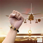 Retro schwarzes und goldenes Linienflugzeug-Armband